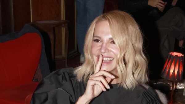 a woman with blonde hair smiling
