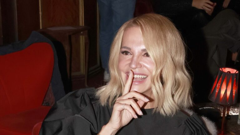 a woman with blonde hair smiling